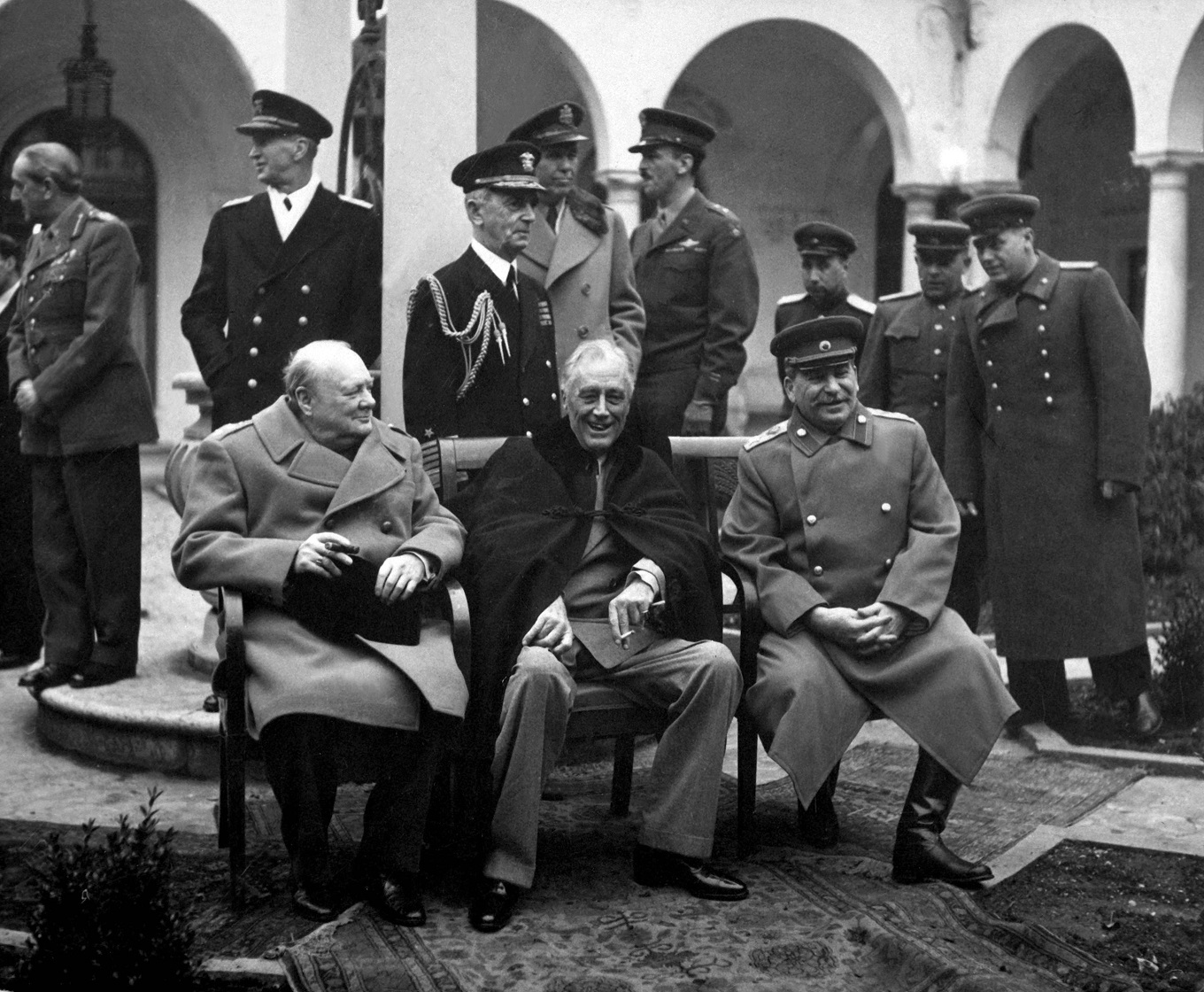 Conference of the Big Three at Yalta makes final plans for the defeat of Germany.  Here the "Big Three" sit on the patio together, Prime Minister Winston S. Churchill, President Franklin D. Roosevelt, and Premier Josef Stalin.  February 1945. (Army)Exact Date Shot UnknownNARA FILE #:  111-SC-260486WAR & CONFLICT BOOK #:  750